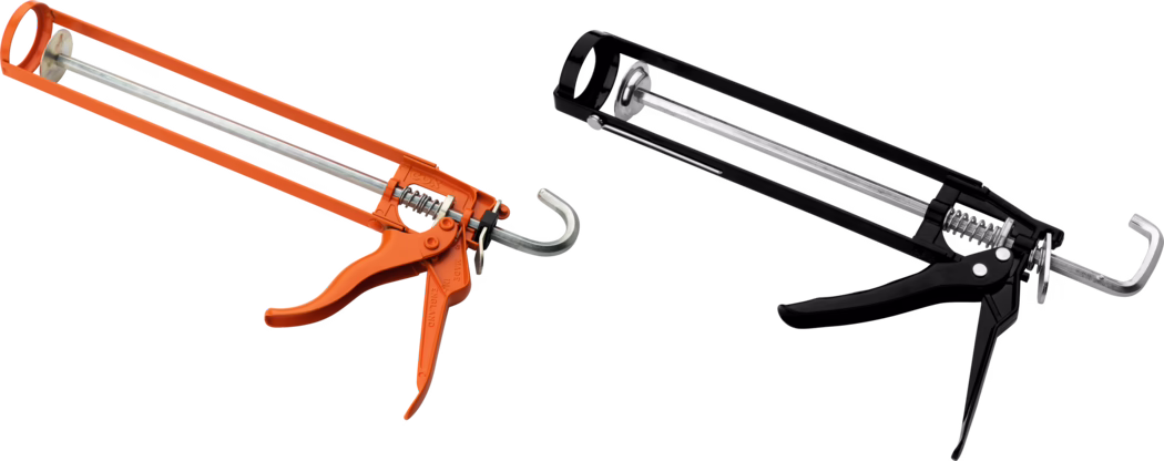 Pajarito_Dummy_Skeleton gun_034695_042476_2021-02 A pair of caulking guns, one orange and one black, positioned next to each other. The orange caulking gun features a metal rod and a trigger mechanism, while the black caulking gun has a similar design, showcasing a sturdy and functional appearance. Both tools are commonly used for applying caulk or sealant in construction and home improvement projects.