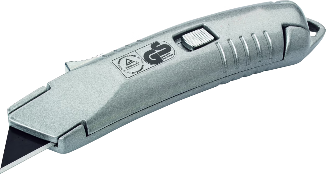 Pajarito_Dummy_Safety knife_083243_2021-02 A silver retractable utility knife with a black blade. The knife features a textured grip, a sliding mechanism for blade extension and retraction, and a safety logo indicating compliance with German safety standards.