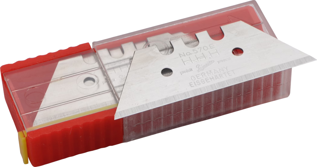 A close-up view of a metal cutter blade housed in a plastic casing. The blade is sharp and triangular in shape, with engravings indicating the product details. The casing is red with a transparent cover, allowing visibility of the blade inside. The base has a yellow section for easy handling.
