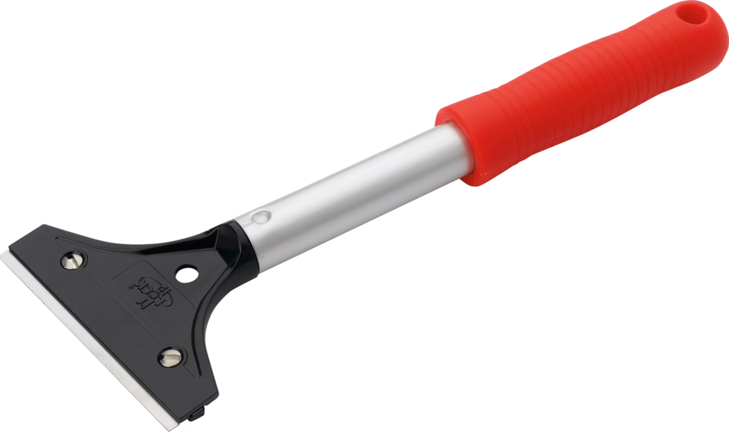 A close-up image of a scraper tool. The tool features a black plastic blade holder with a metal blade edge visible. The handle is made of aluminum and is covered with a bright red rubber grip, designed for comfort and better control. The design is typical of household cleaning tools, specifically used for scraping surfaces clean of stubborn residues or ice.