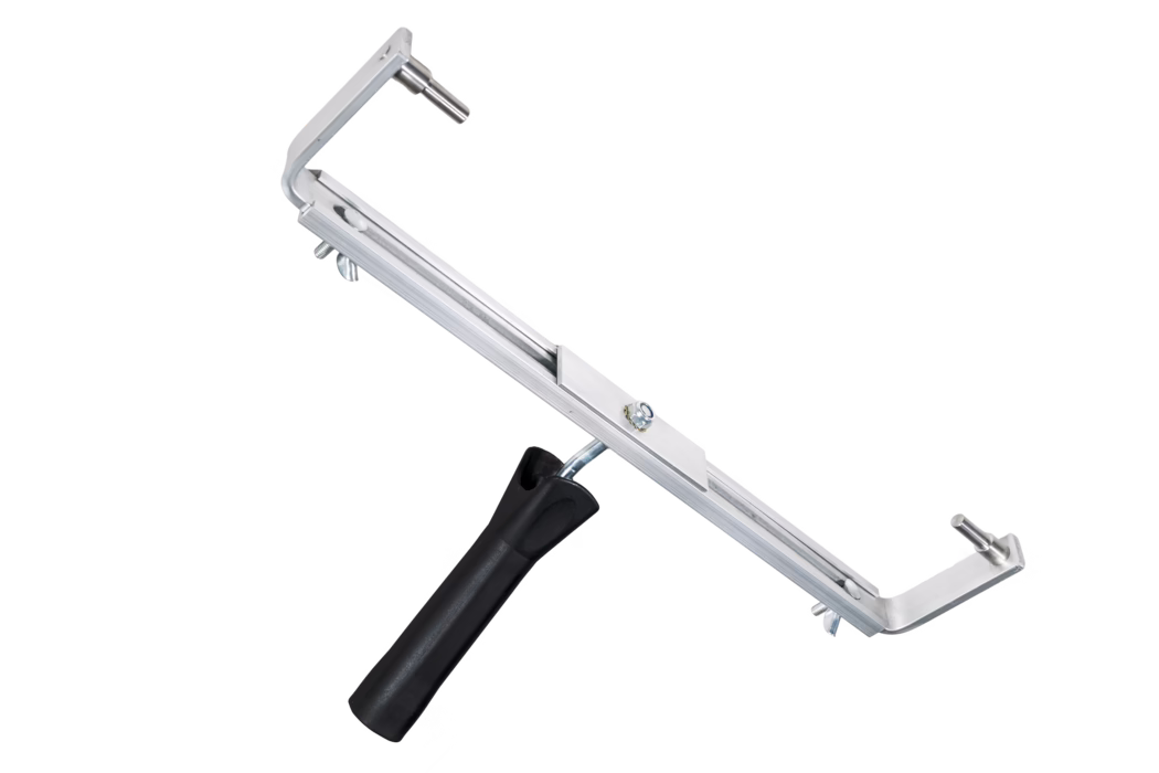 An adjustable aluminium frame with a black plastic handle shown on a white background. The device features a long rectangular aluminium bar with a central sliding bracket secured by a nut, two L-shaped end arms each with a short metal pin for mounting accessories, and wing nuts for width adjustment. The handle is attached via an angled metal stem and is ergonomically shaped for grip. The frame appears suitable for holding squeegees, roller covers or other removable cleaning and painting attachments; finish is matte silver metal with visible fasteners.
