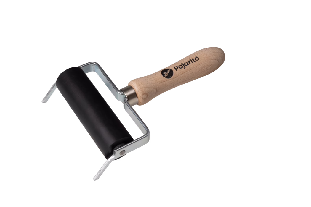 A black rubber brayer with a wooden handle, commonly used in printing and crafting. The brayer has a sturdy metal frame and a smooth roller, ideal for applying ink or paint evenly on surfaces.