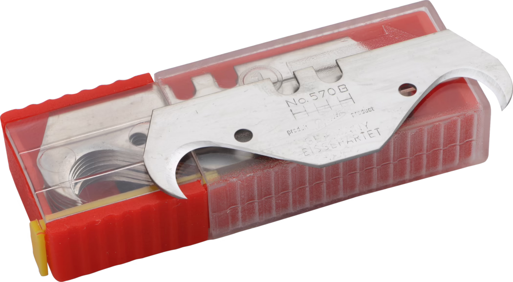 Pajarito_Dummy_Super hook blades_034573_2021-02 A detailed close-up of a metal tool with a curved blade, housed in a transparent plastic case with a red and yellow design. The tool appears to have various functions, indicated by engravings that include a model number (No. 570B). The plastic case shows some wear, suggesting it has been used frequently.