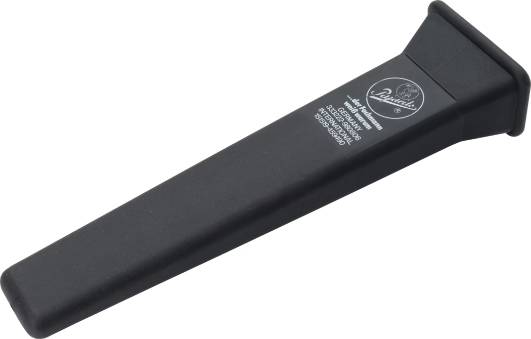 A black plastic tool with a broad, flat end and a slightly raised edge. The tool has a smooth surface and features the branding of a company near the handle. It appears to be designed for scraping or applying pressure on another surface.