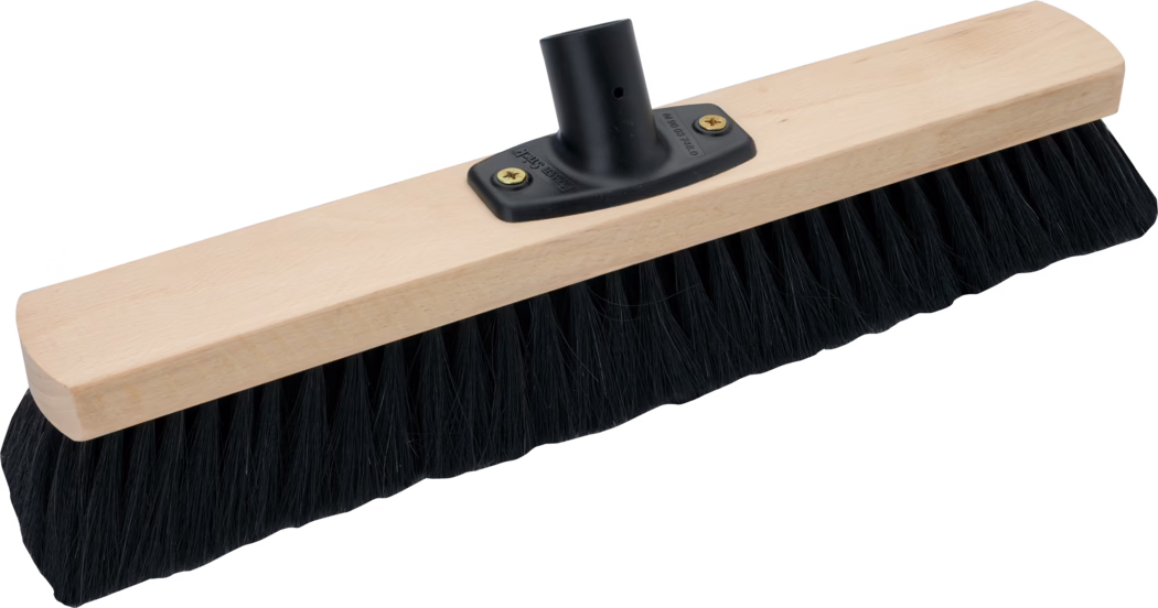 A wooden push-broom head made of light, smooth wood with dense black synthetic bristles and a black plastic handle socket secured by two brass screws; the rectangular block has rounded ends and the long even bristles are suitable for sweeping floors.