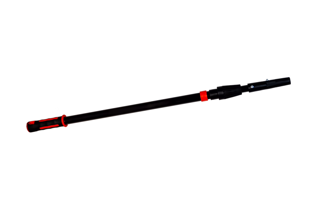 A black telescopic extension pole with red accent rings and an ergonomic red-and-black rubber handle. The pole appears to be made of lightweight metal or reinforced plastic and features a straight shaft with an adjustable locking mechanism near the working end plus a connector for attaching tools such as paint rollers, brushes or cleaning heads. The matte black surface contrasts with the red trim and the grip has textured rubber inserts for slip resistance. The image shows the pole isolated on a white background, photographed diagonally to emphasize the handle and adjustable coupling.