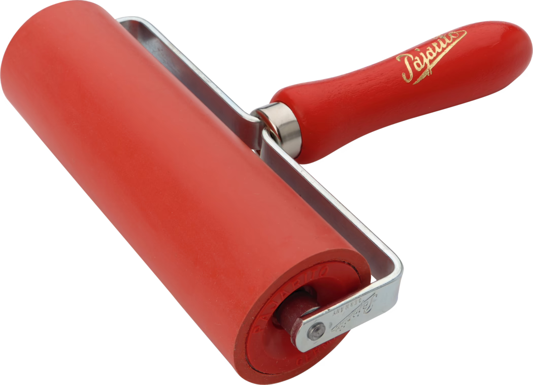 A red rubber roller with a wooden handle, mainly used for crafting or painting. The roller is mounted on a metal frame and is ideal for even application of paint or ink. The handle is ergonomically designed for a comfortable grip.