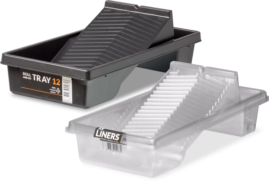 The image showcases two paint trays positioned side by side. The left tray is a black paint tray labeled 'ROLL AND GO TRAY 12' and is made from 100% recycled plastics. It features a sloped surface designed for easy rolling of paint. The right tray is transparent and includes a similar sloped design, meant for compatibility with the black tray. Both trays serve as practical tools for painting projects, allowing users to easily access and manage paint during application.