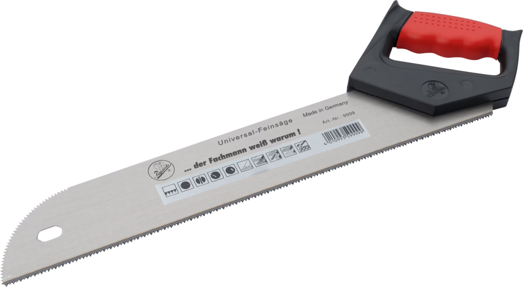 Pajarito_Dummy_Universal saw_037850_2021-02 A universal fine saw with a metallic blade featuring serrated edges. The saw has a red and black ergonomic handle, designed for comfort and grip. The blade is marked with various symbols indicating its intended use, and it is made in Germany.